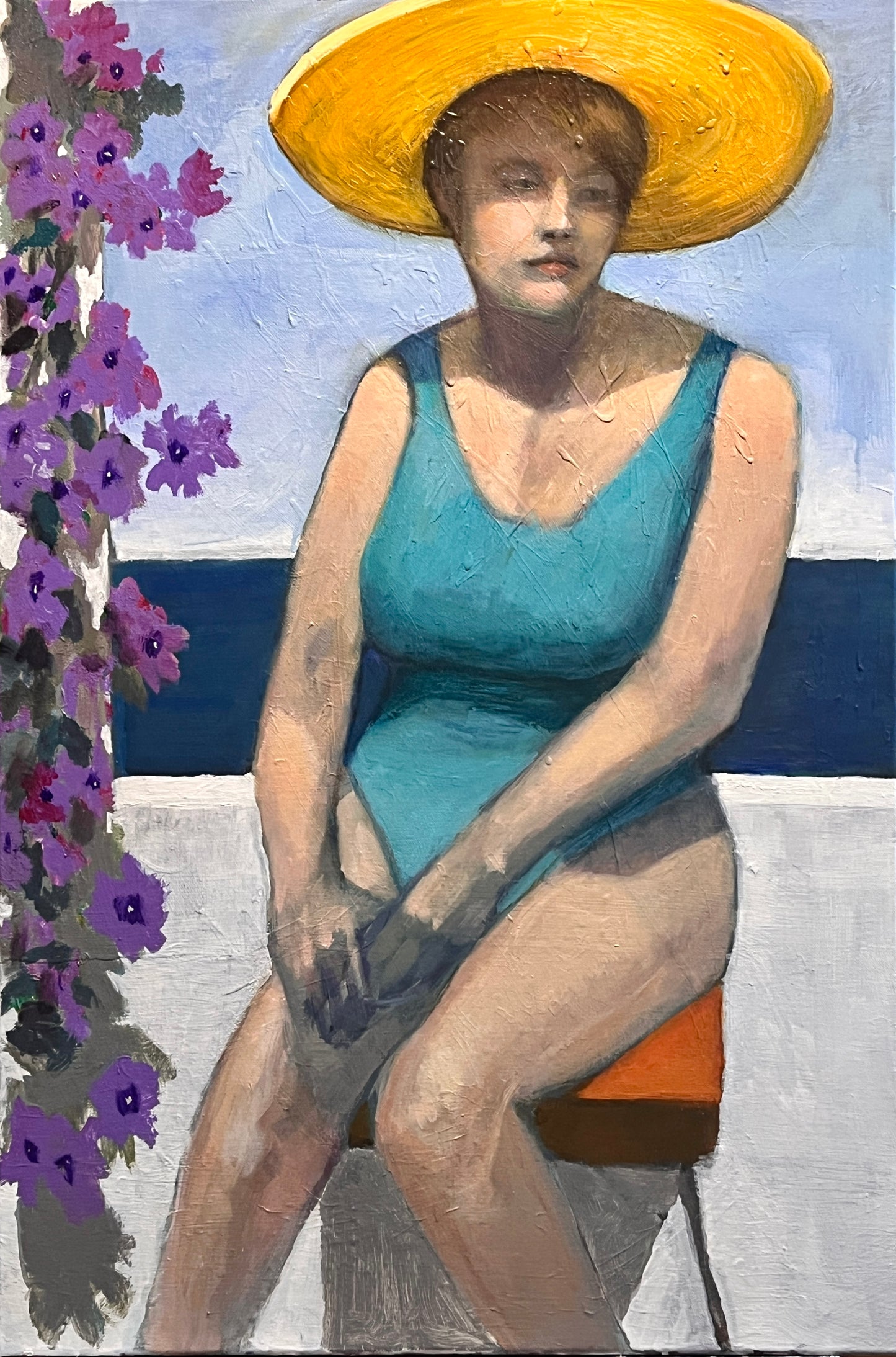 Woman in a blue swimsuit and yellow hat sitting on a bench with purple flowers to the side.